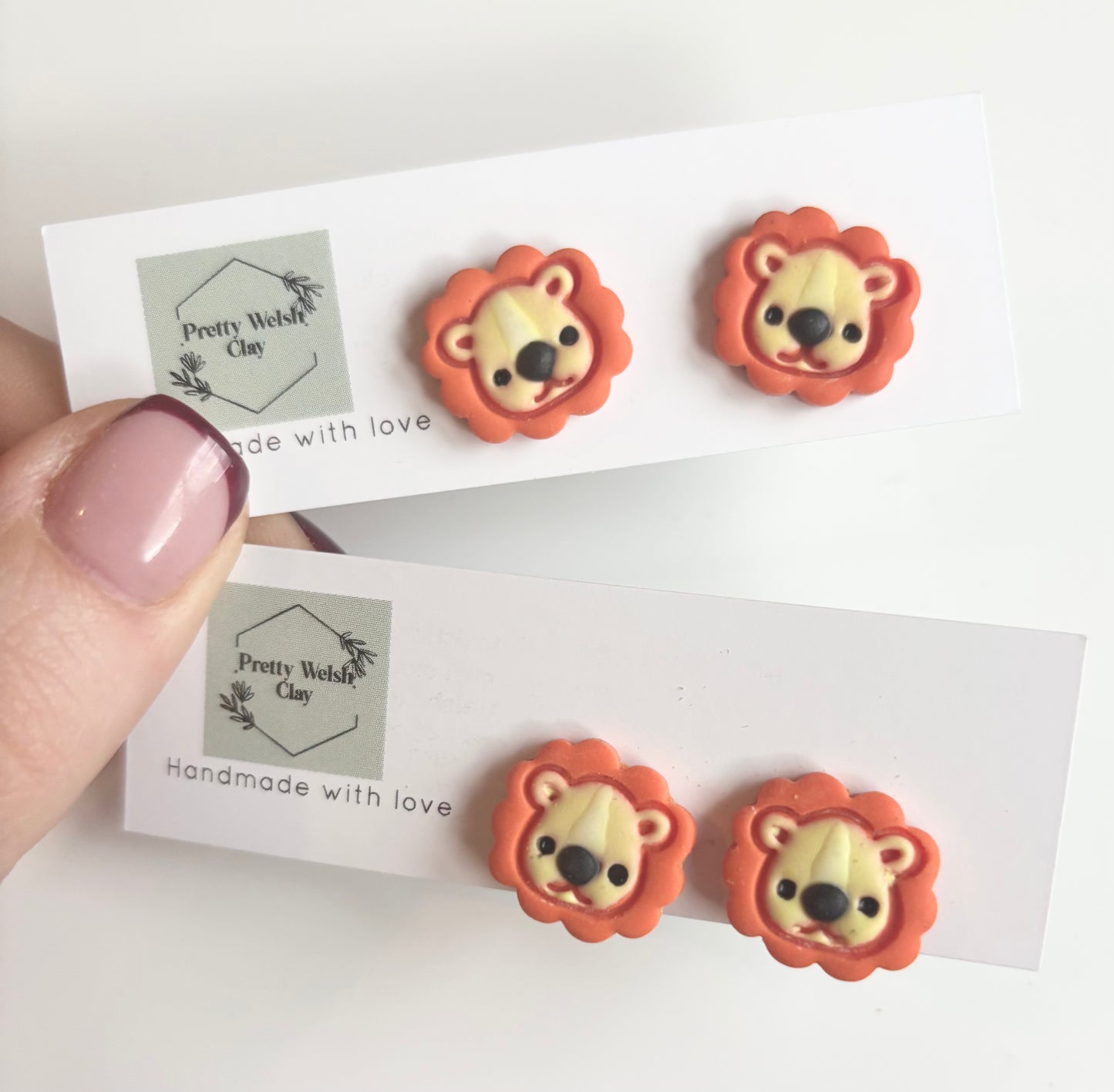 Lion studs