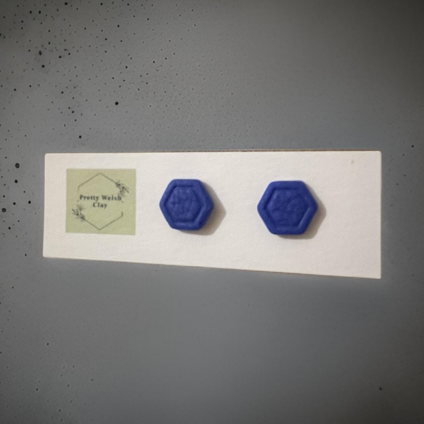 Blue hexagon studs