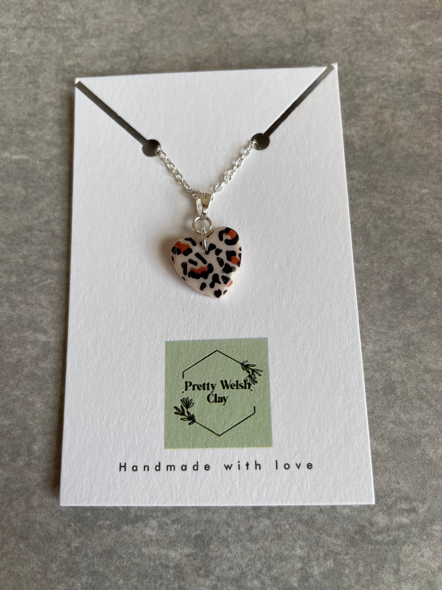 White leopard print heart necklace